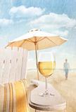 Glass of  wine on adirondack chair at the beach