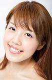 smiling beautiful asian woman's face with fresh clean skin