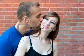 Portrait of Young kissing couple
