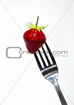 strawberry on a steel fork