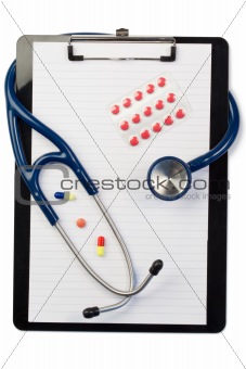 Note pad and stethoscope with color pills and blister strip