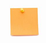 Orange post-it with drawing pin