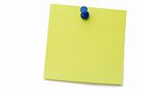 Yellow post-it with drawing pin