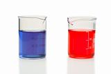Red and blue liquid in beakers