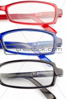 Spectacles with blue frames black frames and red frames