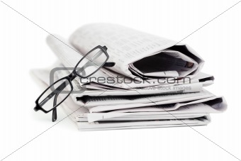 Newspapers and black glasses