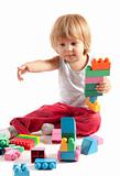 Cute little boy playing with blocks 