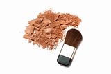 Cosmetic powder brush and crushed blush palette isolated on white
