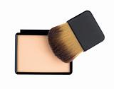 Beige compact cosmetic powder and brush