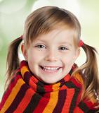 little girl in striped scarf