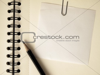 Note paper clip on notebook
