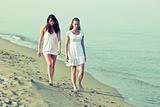 Female Friends Walking Together in the Seaside