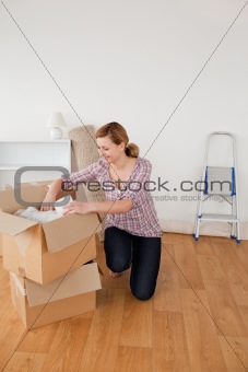 Beautiful blond-haired woman preparing to move house 