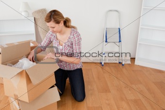 Blond-haired woman preparing to move house 