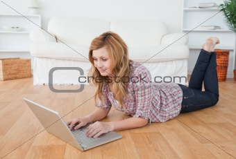 Cute woman chatting on her laptop