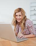 Blond-haired woman chatting on her laptop