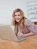 Blonde woman chatting on her laptop
