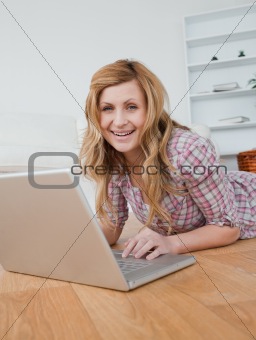 Blonde woman chatting on her laptop