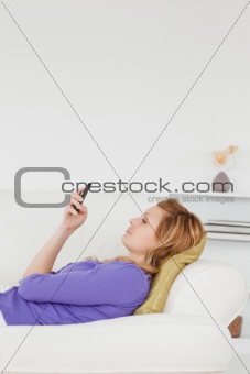 Profile portrait of a beautiful woman writing a text message whl