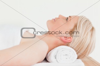 Smiling blonde woman enjoying her treatment in a Spa centre
