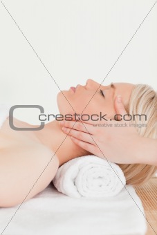 Cute blonde woman enjoying her treatment in a Spa centre
