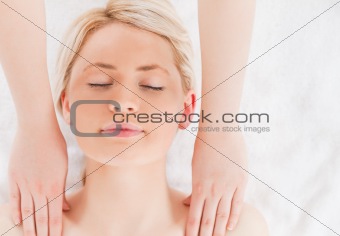 Young blond-haired woman having a massage