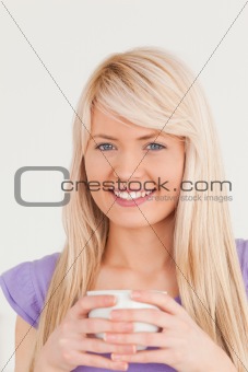 Attractve woman drinking hot drink