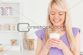Attractive female drinking hot drink
