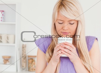 Gorgeous female drinking hot drink