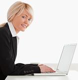 Professional female posing while relaxing on a laptop