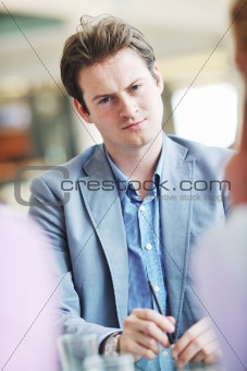 young business man alone in conference room