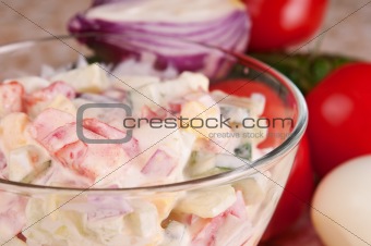 Fresh vegetable salad dressed with sour cream.