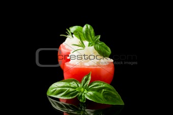 Stuffed tomatoes with rice isolated on black