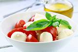 Traditional Italian Caprese Salad mozzarella with tomatoes and basil