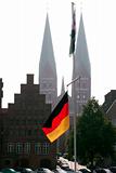 German flag and church towers
