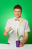 Parody lover man "nerd" watering tulip