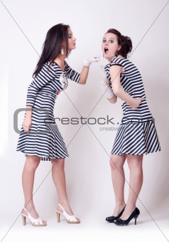 studio fashion image of two beautiful young women