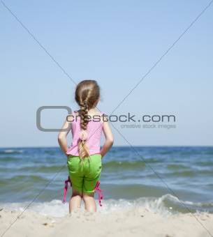 Happy child at the summer beach.