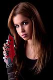 beautiful young woman with a electric guitar, on black, studio shot