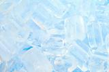 fresh cool ice cube background in blue light