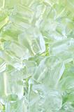 fresh cool ice cube background in green light