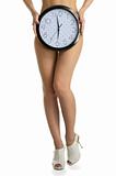 Women's legs and round clock
