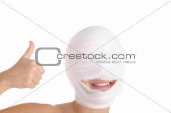 Satisfied woman with bandaged head