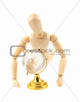 Wooden dummy and glass earth globe