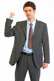 Angry modern businessman showing get out gesture

