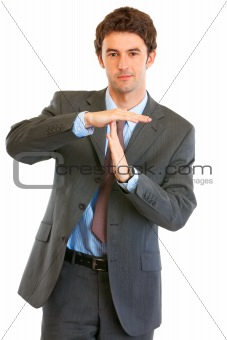 Confident young businessman time out crossed arms
