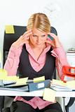 Tired business woman sitting at workplace overwhelmed with sticky reminder notes 
