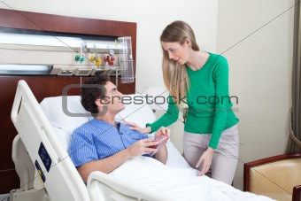 Woman paying a visit to the patient