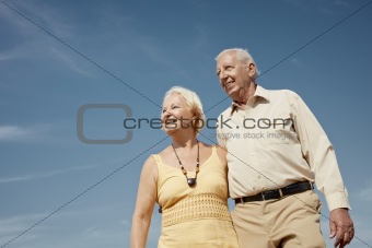 old man and woman contemplating the sky