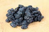 dried fruits - raisins on a brown natural background